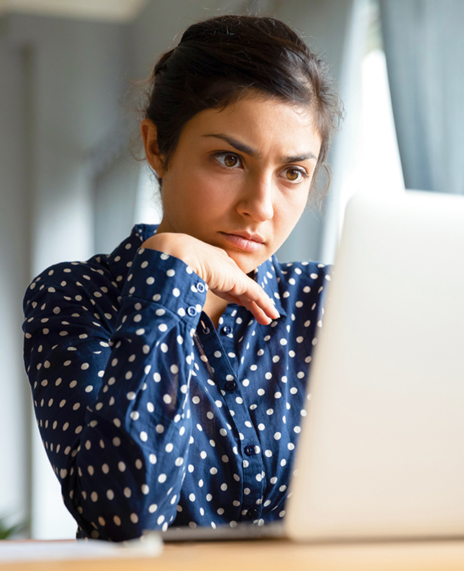 employee-engagement-survey-img A female employees taking an engagement survey and feeling frustrated