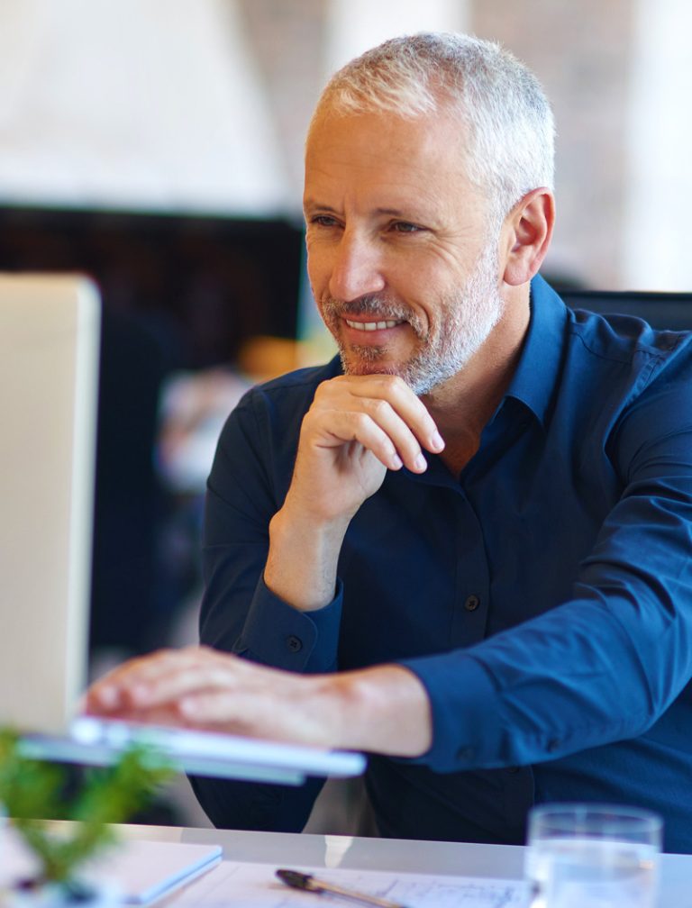 White haired male executive researching motivation in the workplace