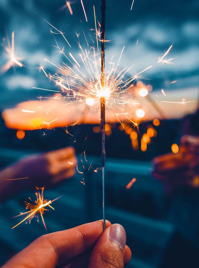 A sparkler sparking bright at night, just as an employee shines bright when they know how to tap into their energy