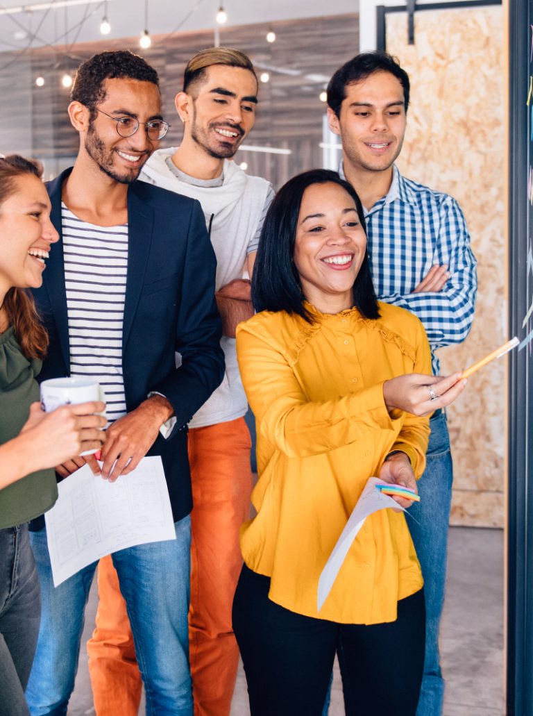 A team participating in an MCode Team workshop in their office