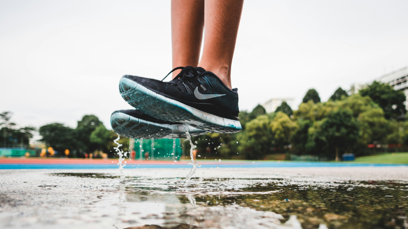 jumping above puddles in NIKE gym shoes