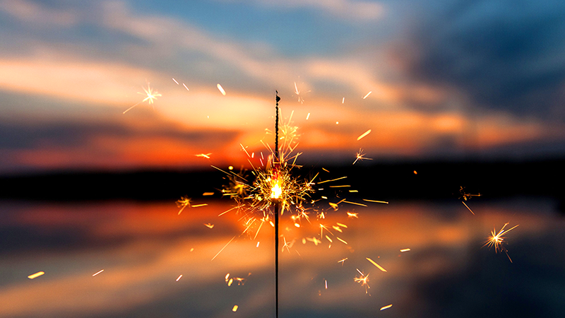 Sparkler with sunset in the background