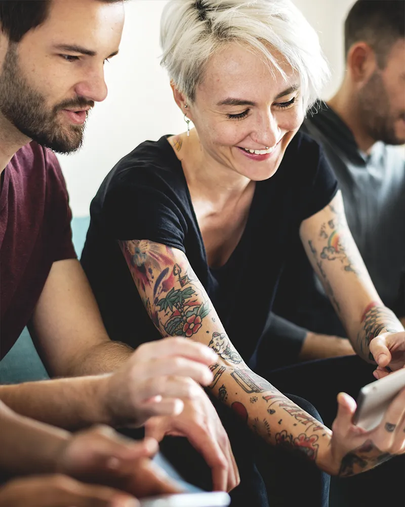 Two coworkers taking their MCode Assessment online.