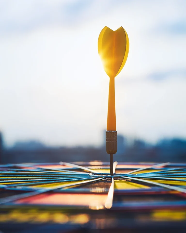 A dart hitting a bullseye