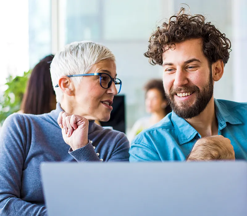 A woman and a man working together on a project.