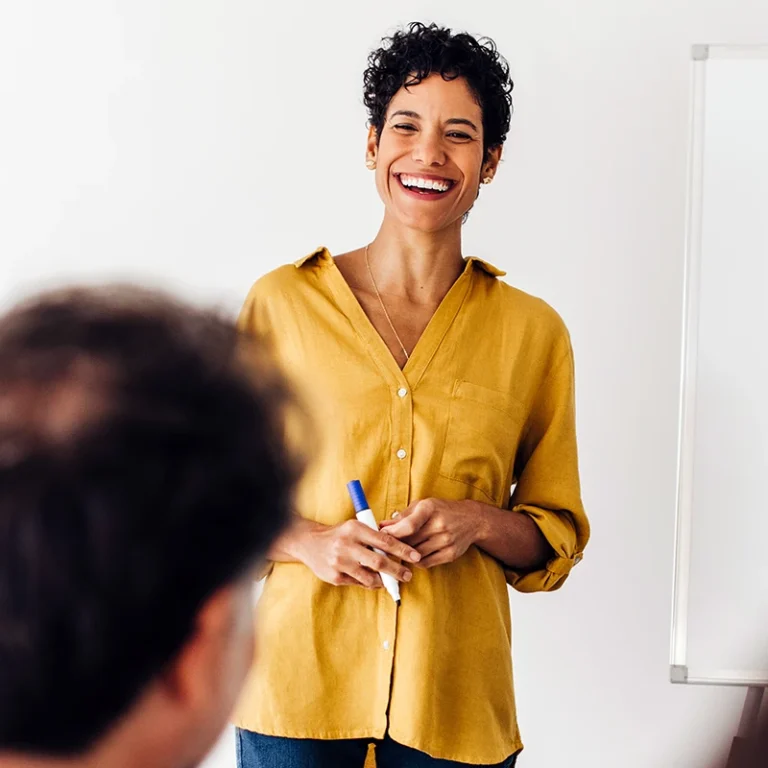 A woman leading a MCode training session