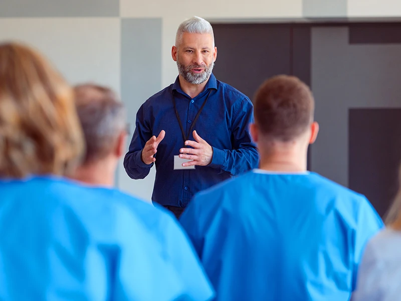 A man training a team with MCode