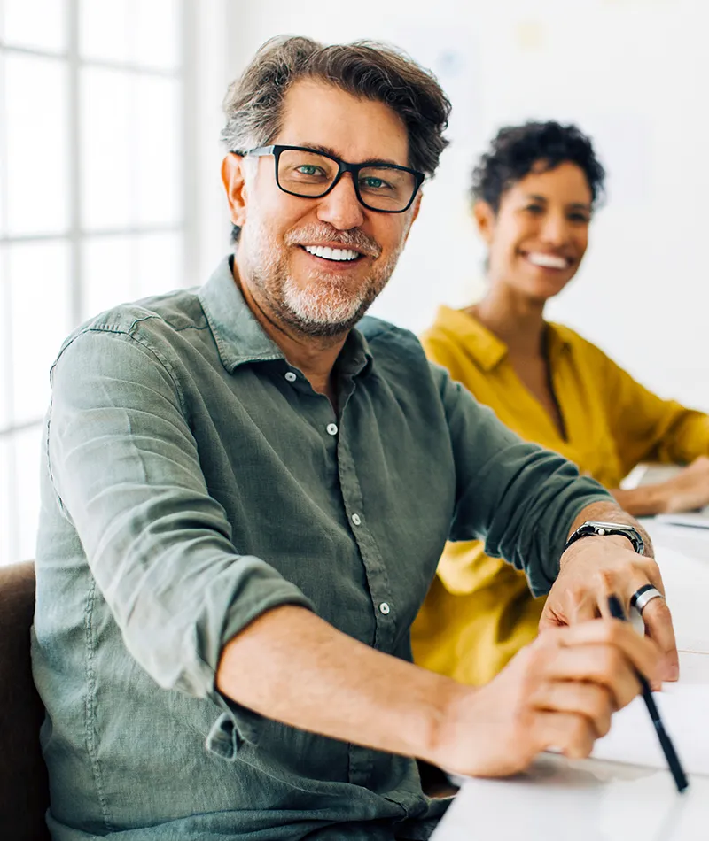 Man and a woman at a successful work meeting