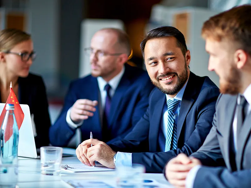People in a work meeting talking to one another about motivation.